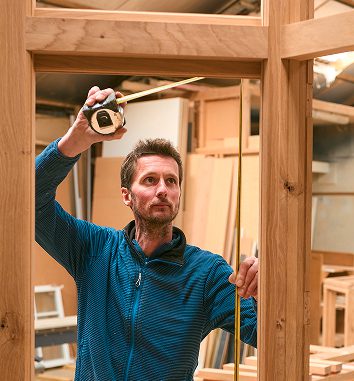 man measuring frame