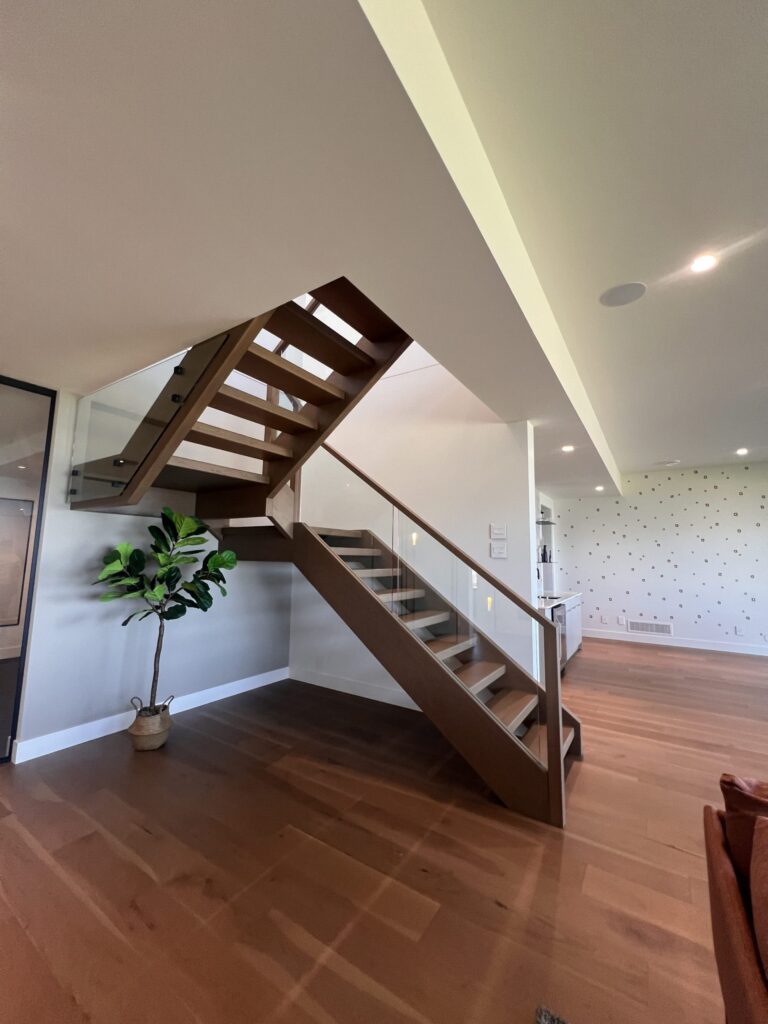 Interior Housed Staircase Open Rise Wood Tread Glass Railing Wood Posts Top Rail