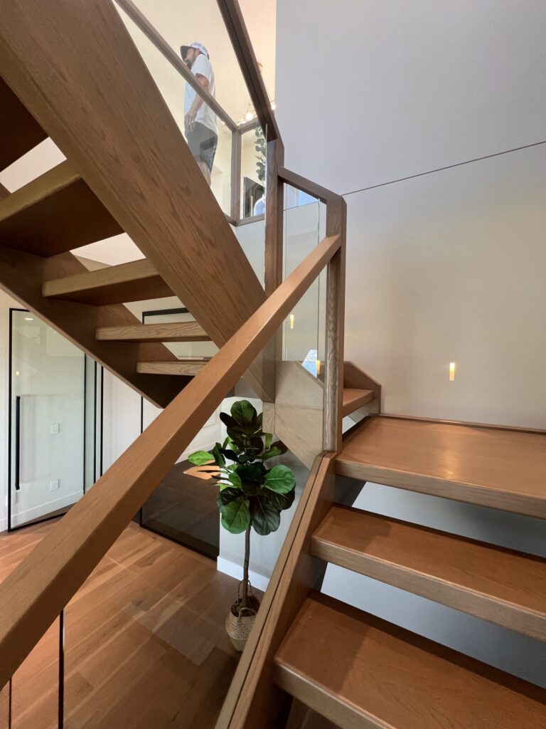 Interior Floating Housed Stairs Open Rise Oak Treads Glass Railing Oak Top Cap