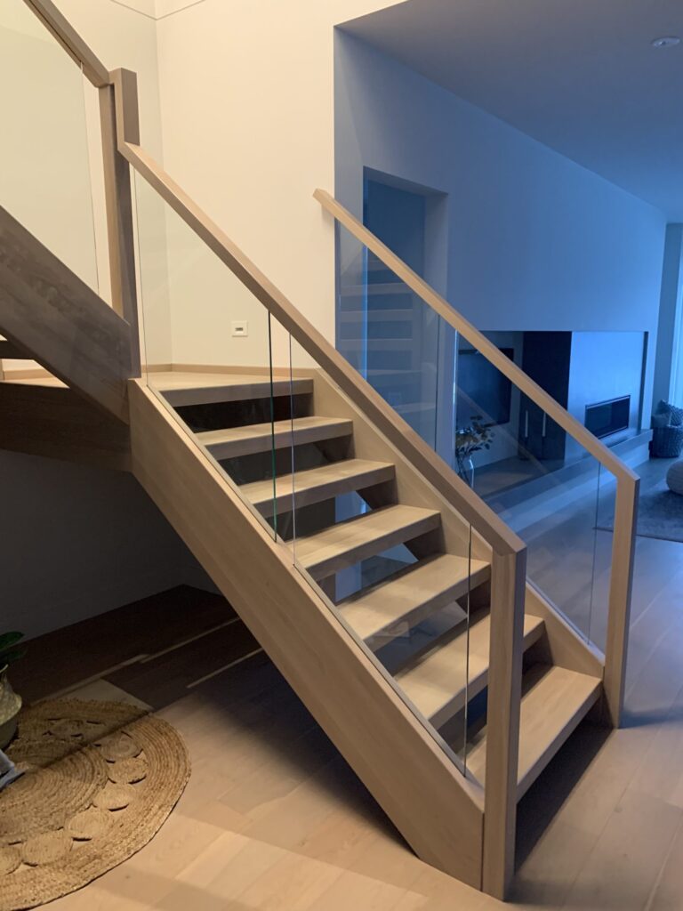 Interior Open Rise Wood Tread Stairs Glass Railing Wood Top Cap and Posts