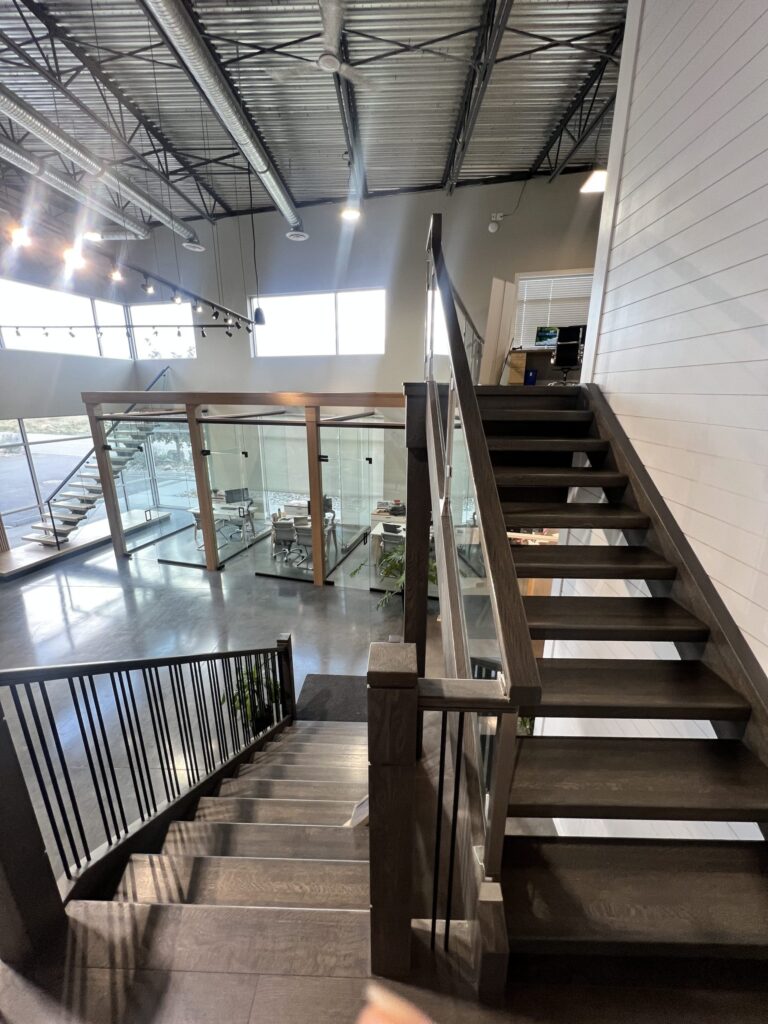 Housed Dual Stringer Floating Open Rise Stair with Metal Railing U-Shaped